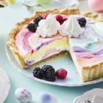 A colorful Easter Swirl Pie with a pastel marbled design, served on a table with Easter eggs, flowers, and a slice plated with whipped cream.