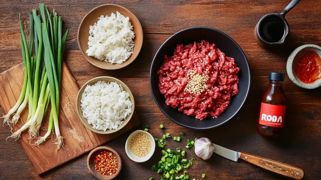 Flat-lay shot of ingredients for Spicy Firecracker Beef, including ground beef, soy sauce, brown sugar, sriracha, rice vinegar, garlic, and chili flakes.